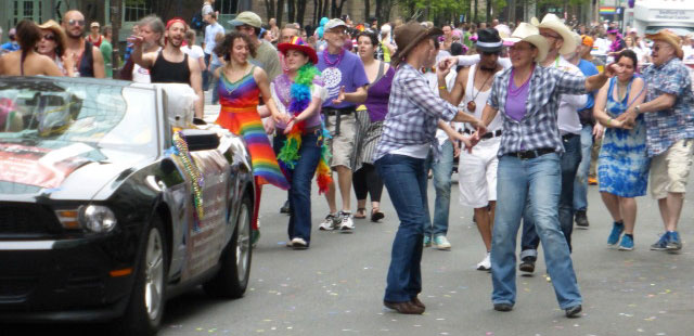 Gays for Pasty folk dance along the Boston Gay Pride Parade route in 2014